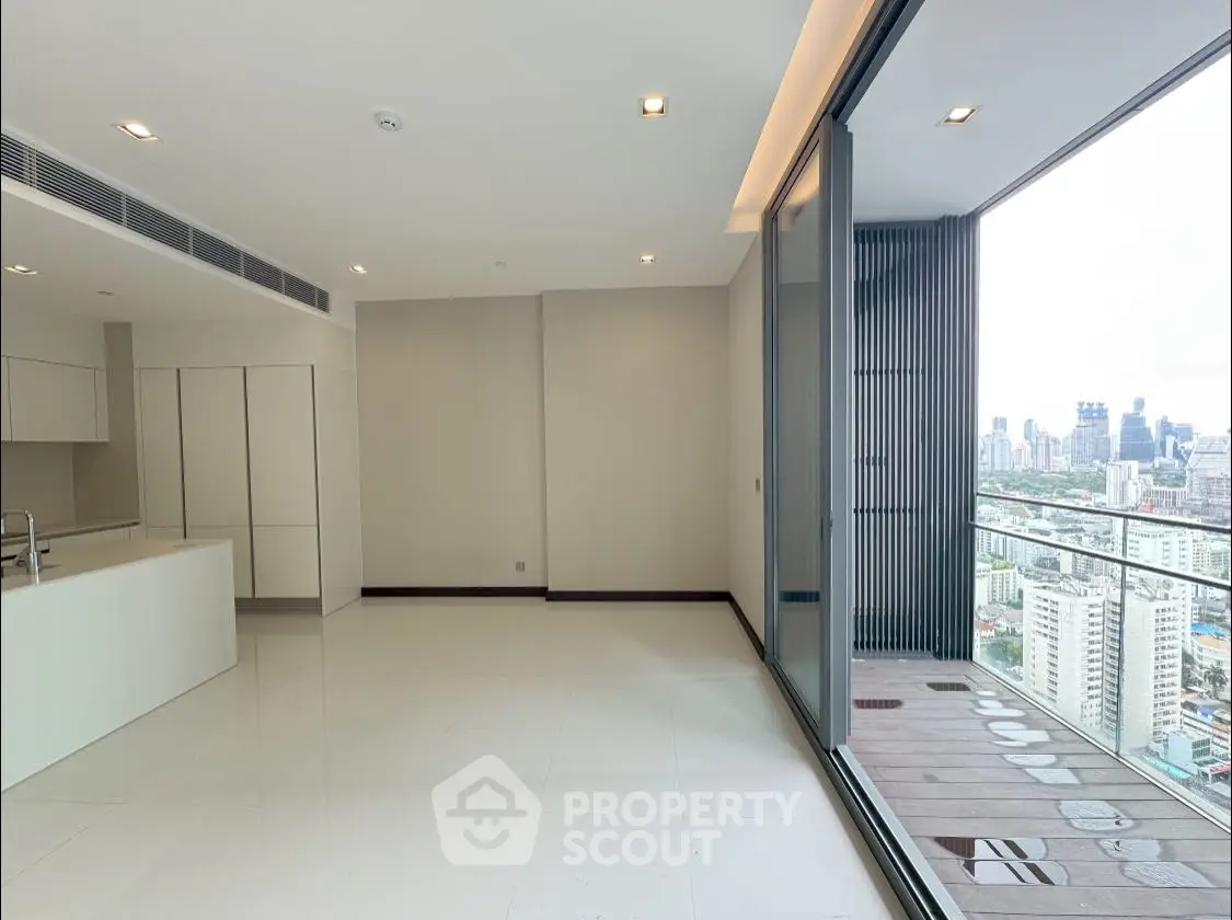 Spacious modern living room with city view and large balcony in luxury apartment