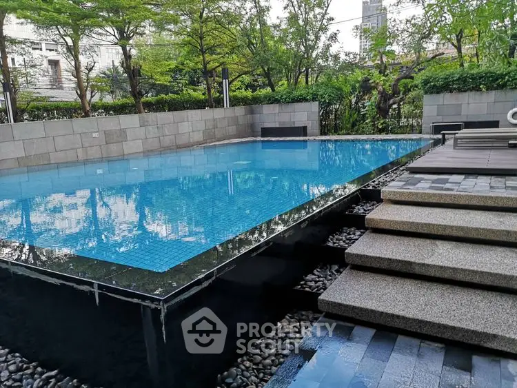Luxurious outdoor pool with modern design and lush greenery