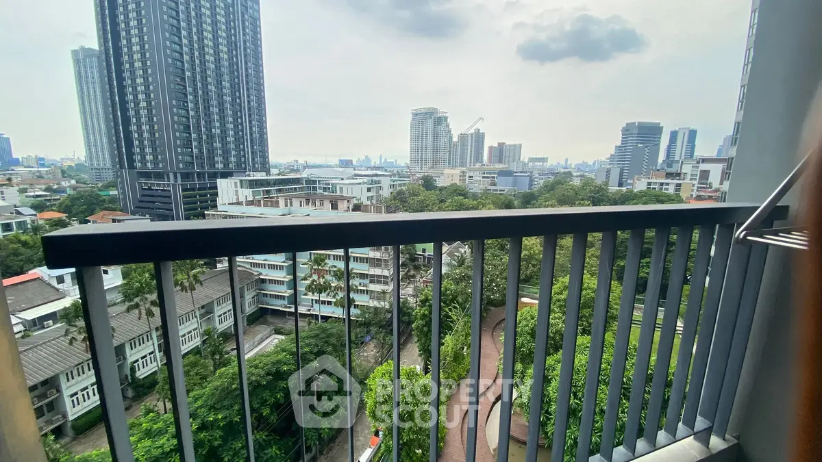 Stunning cityscape view from a modern balcony in a high-rise building.