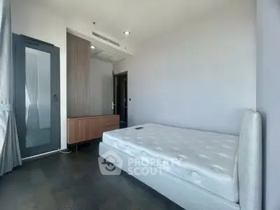 Spacious bedroom with modern design and ample natural light