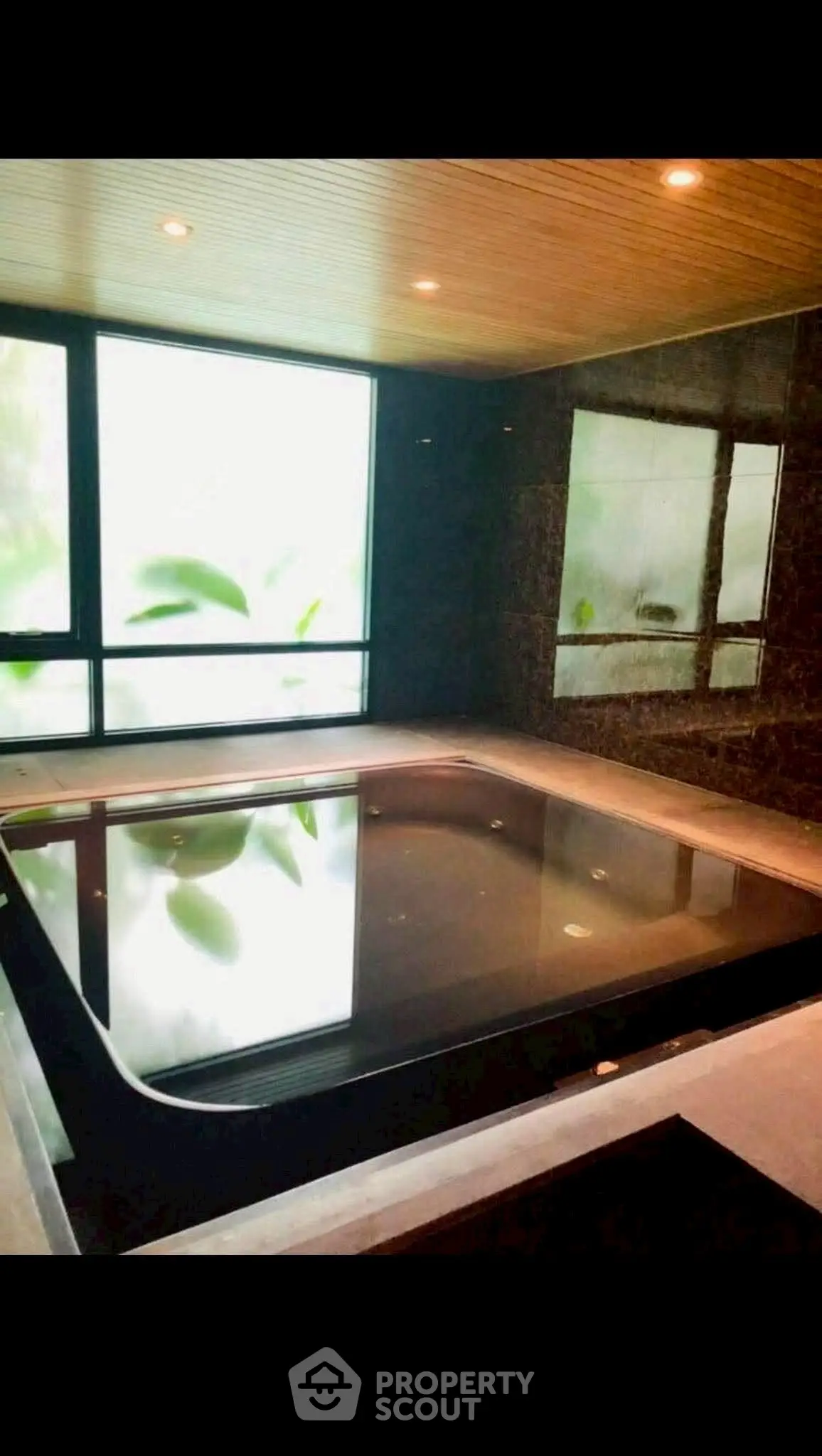 Luxurious indoor pool with modern design and ambient lighting
