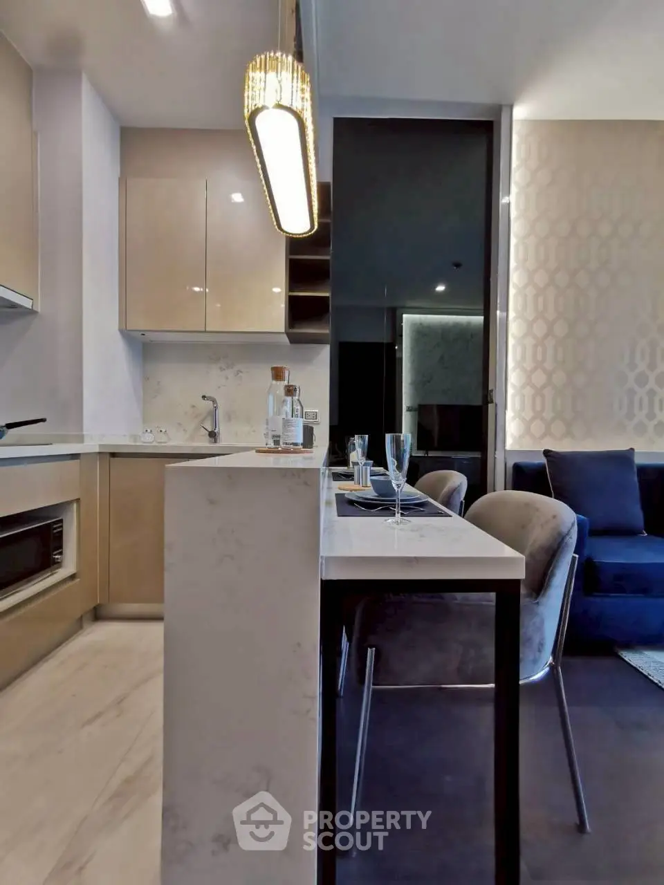 Modern kitchen with open layout and stylish dining area in a contemporary apartment.