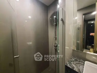 Modern bathroom with sleek shower and elegant marble countertop