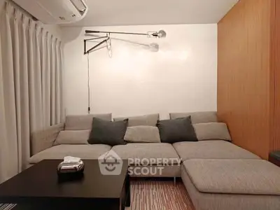 Cozy living room with modern sectional sofa and stylish lighting