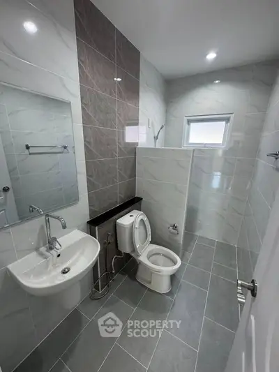 Modern bathroom with sleek tiles and contemporary fixtures