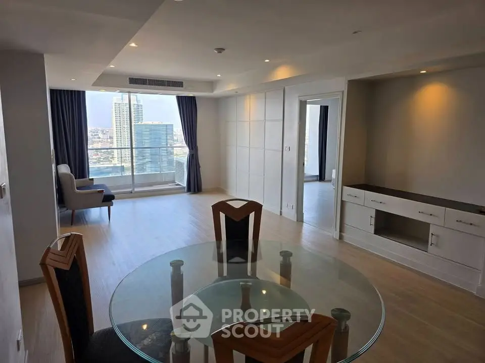 Spacious modern living room with city view and elegant dining area