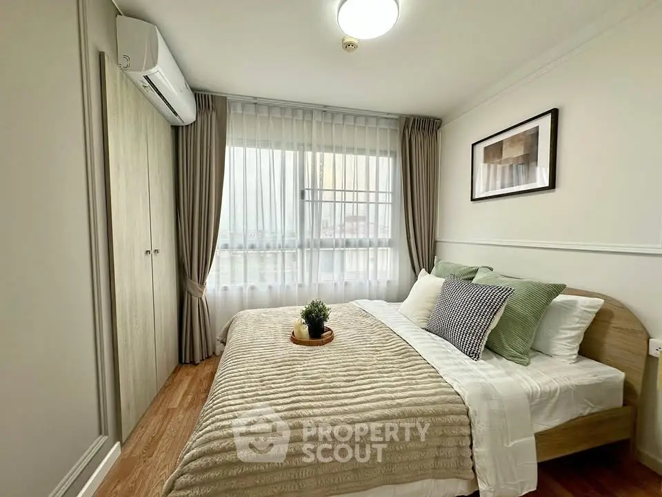 Cozy bedroom with elegant decor and natural light, featuring a comfortable bed and stylish curtains.