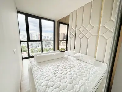 Luxurious bedroom with panoramic city view and modern decor