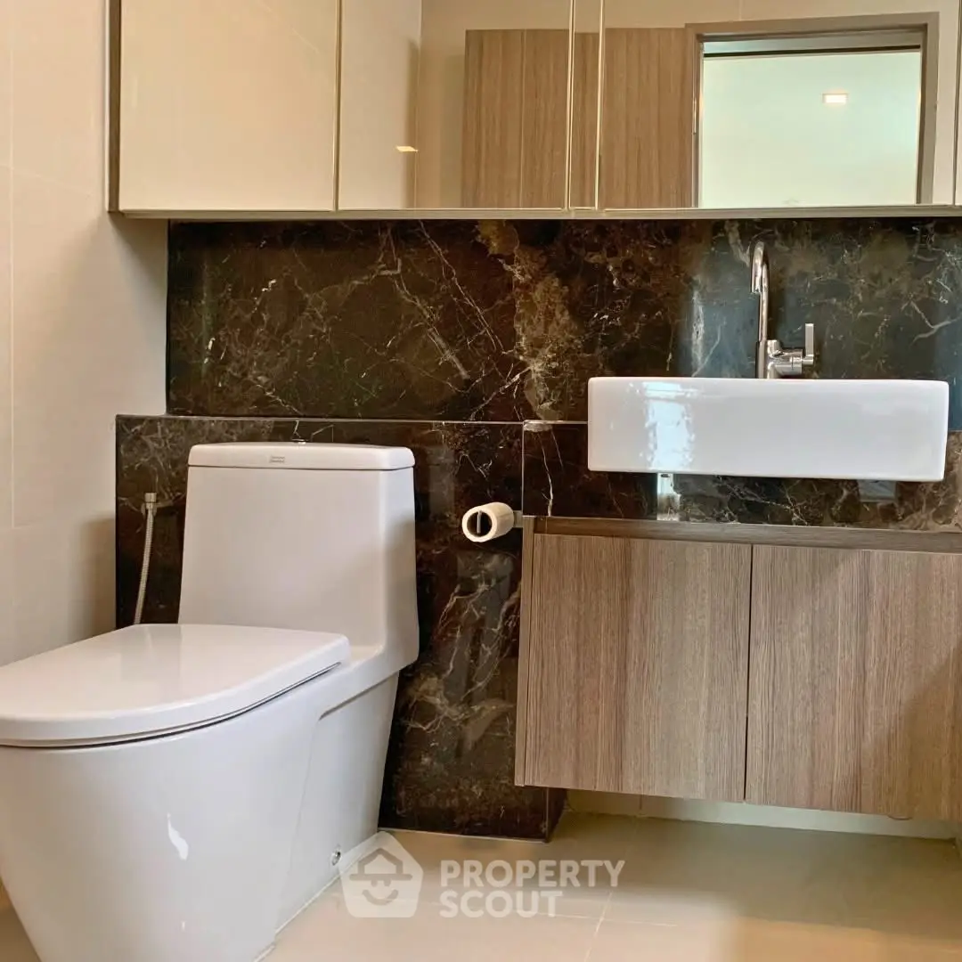 Modern bathroom with sleek fixtures and elegant marble accents