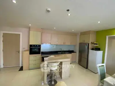 Modern kitchen with sleek cabinets and built-in appliances