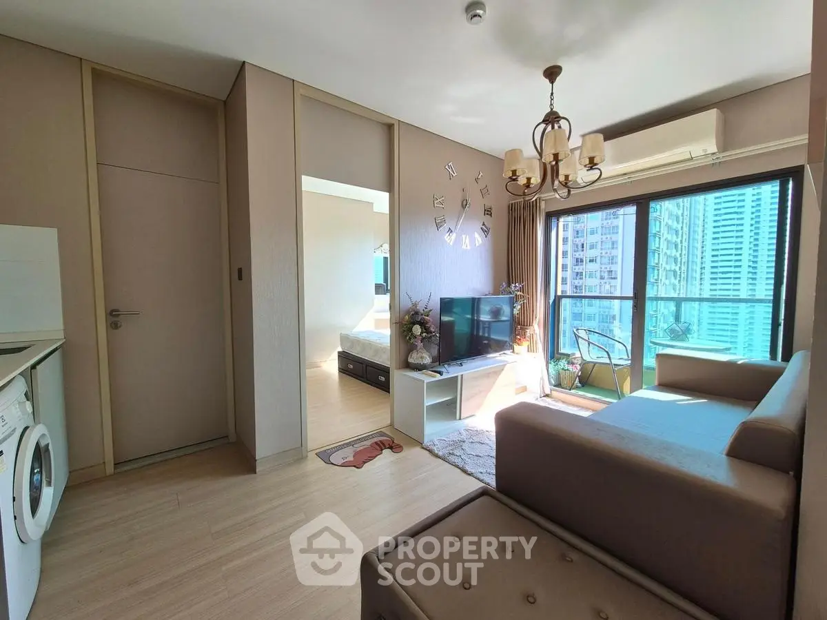 Modern living room with balcony view in high-rise apartment