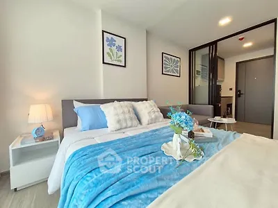 Modern bedroom with stylish decor and cozy blue accents
