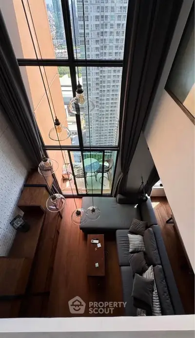 Stunning high-rise living room with floor-to-ceiling windows and breathtaking city view.