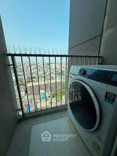 High-rise apartment balcony with washing machine and stunning city view