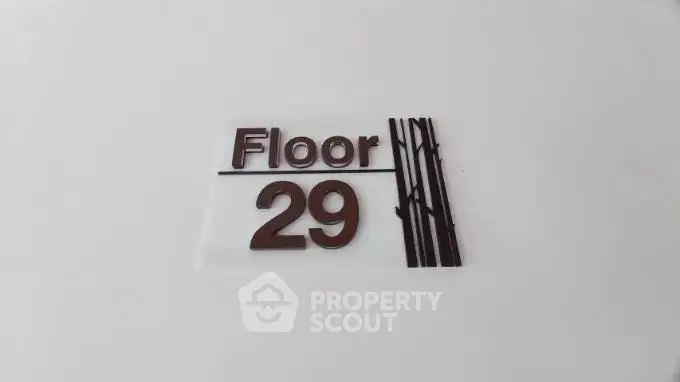 Modern floor number sign for 29th floor in sleek building design.