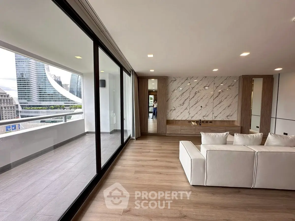 Luxurious modern living room with balcony and stunning city view