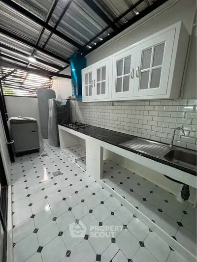 Modern kitchen with sleek design and ample storage space