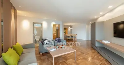 Spacious modern living room with stylish decor and open dining area.