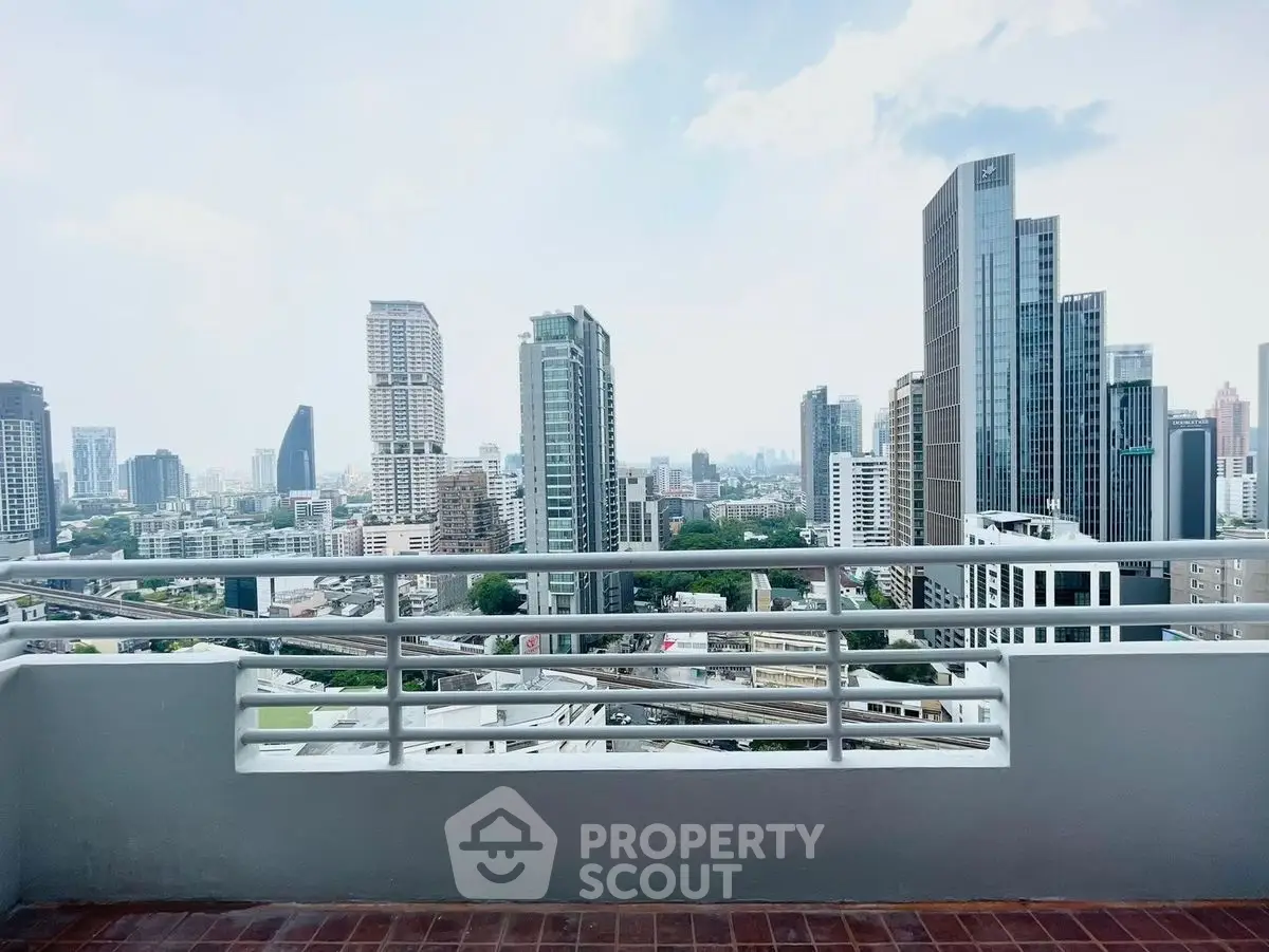 Stunning cityscape view from a high-rise balcony in a modern urban setting.