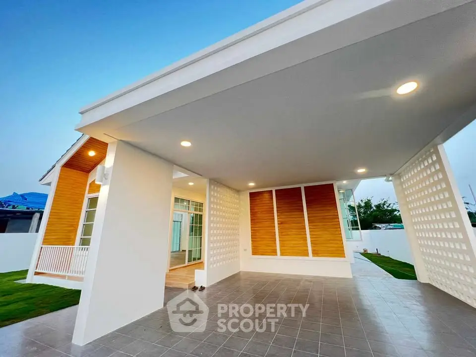 Modern single-story home with spacious carport and stylish exterior design.