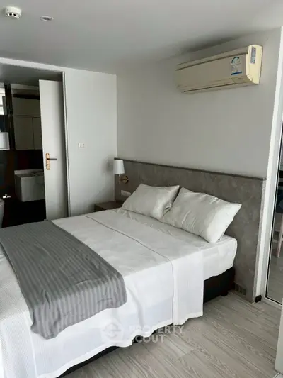 Modern bedroom with air conditioning and stylish decor