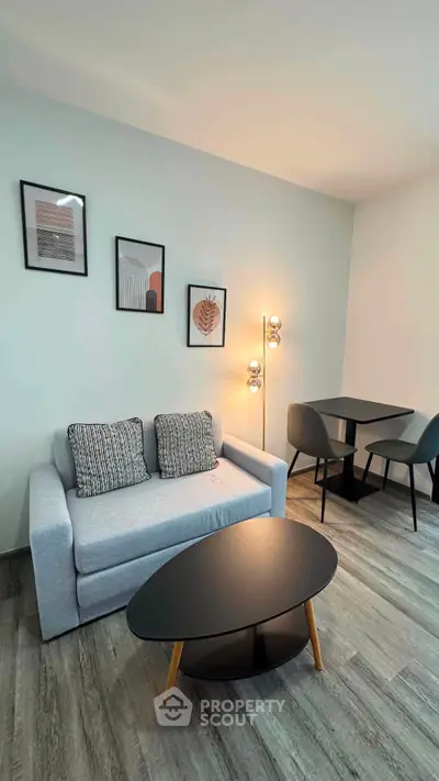 Modern living room with stylish decor and cozy seating area, perfect for relaxation and entertaining.