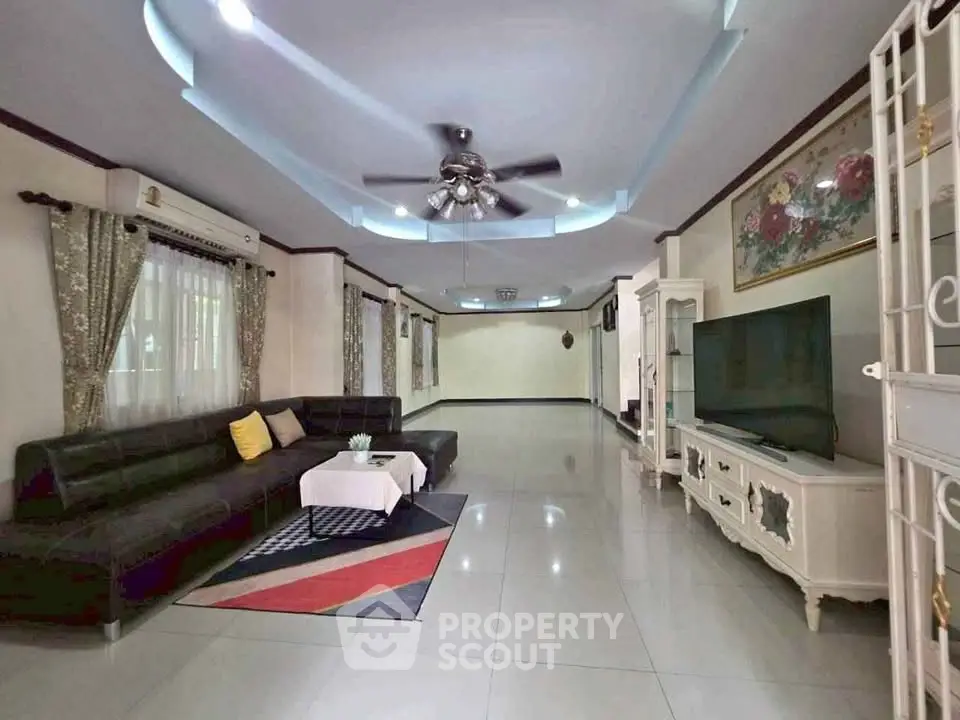 Spacious living room with modern decor and large sectional sofa