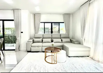 Luxurious modern living room with elegant white sofa and chic decor