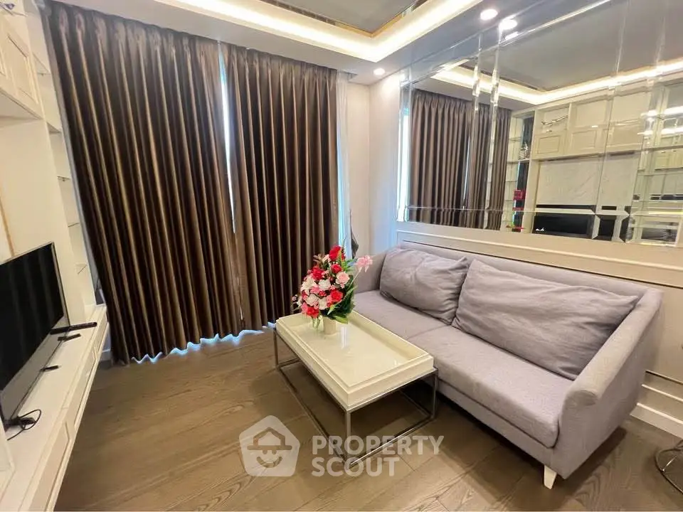 Elegant living room with modern decor, plush sofa, and stylish curtains in a cozy apartment setting.