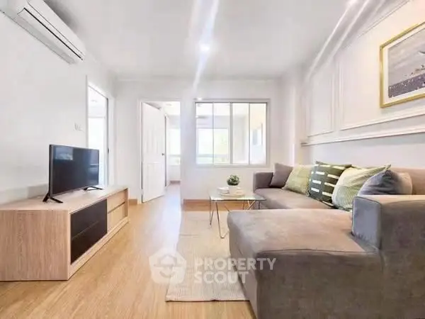 Bright and modern living room with stylish furniture and natural light.