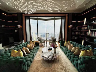 Luxurious living room with panoramic city view, elegant green sofas, and modern decor