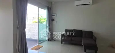 Modern living room with sliding glass doors and air conditioning