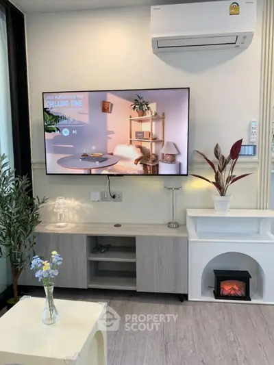 Modern living room with stylish decor and wall-mounted TV