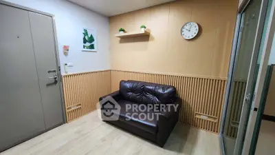 Cozy living room with modern decor and comfortable leather sofa