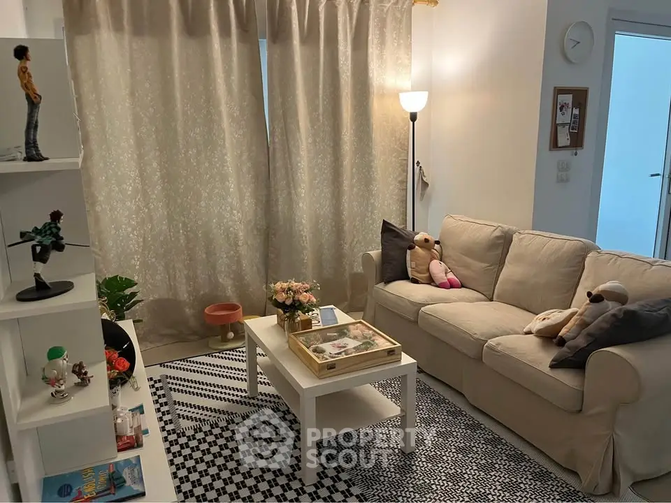 Cozy living room with plush sofa, stylish decor, and ambient lighting.