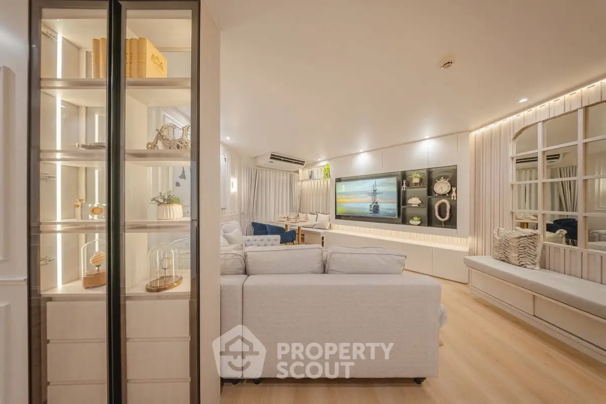 Luxurious living room with elegant decor and spacious seating area, perfect for relaxation and entertainment.