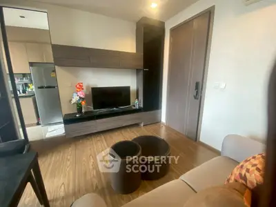 Modern living room with sleek furniture and open kitchen view