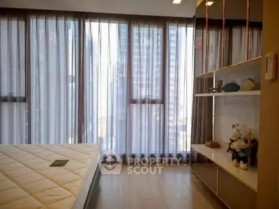 Modern bedroom with floor-to-ceiling windows and elegant decor