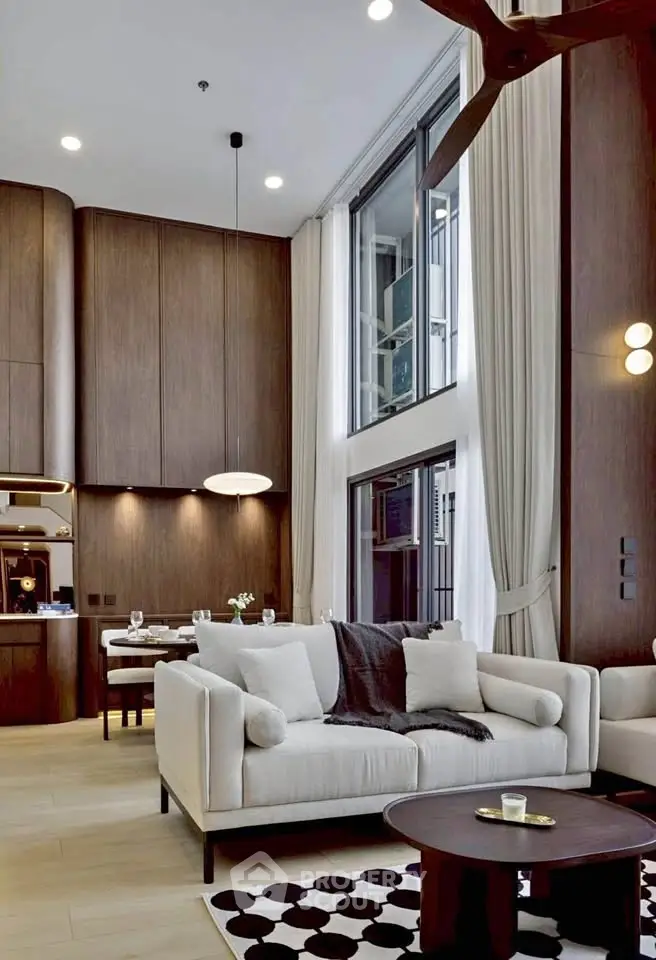 Luxurious modern living room with high ceilings and elegant decor