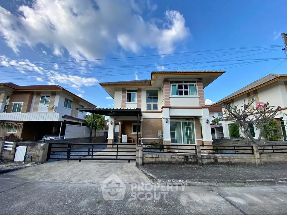 Charming two-story suburban house with modern design and spacious driveway.