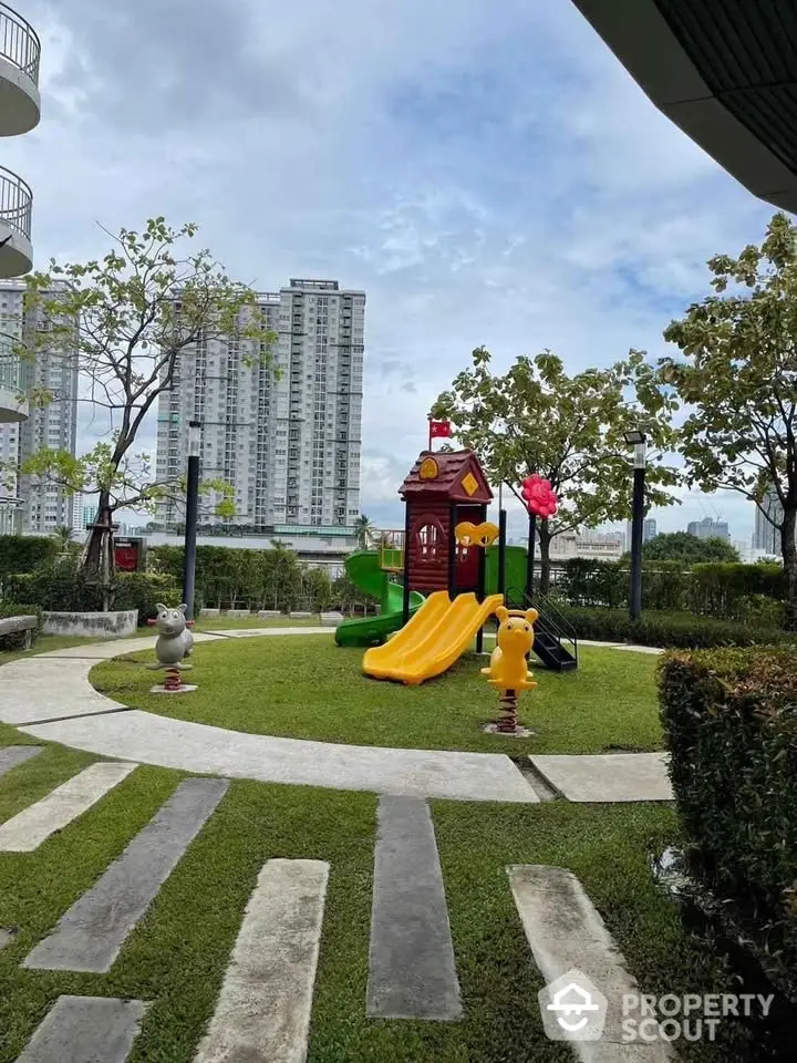 Modern residential playground with slides and cityscape view