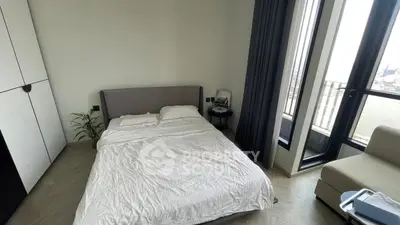 Modern bedroom with large windows and river view, featuring minimalist decor and cozy ambiance.