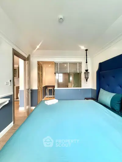Elegant bedroom with blue accents and modern decor