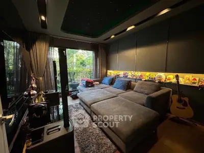 Cozy living room with plush sectional sofa, large window view, and stylish decor for modern comfort.