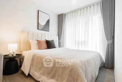 Elegant bedroom with modern decor and natural light