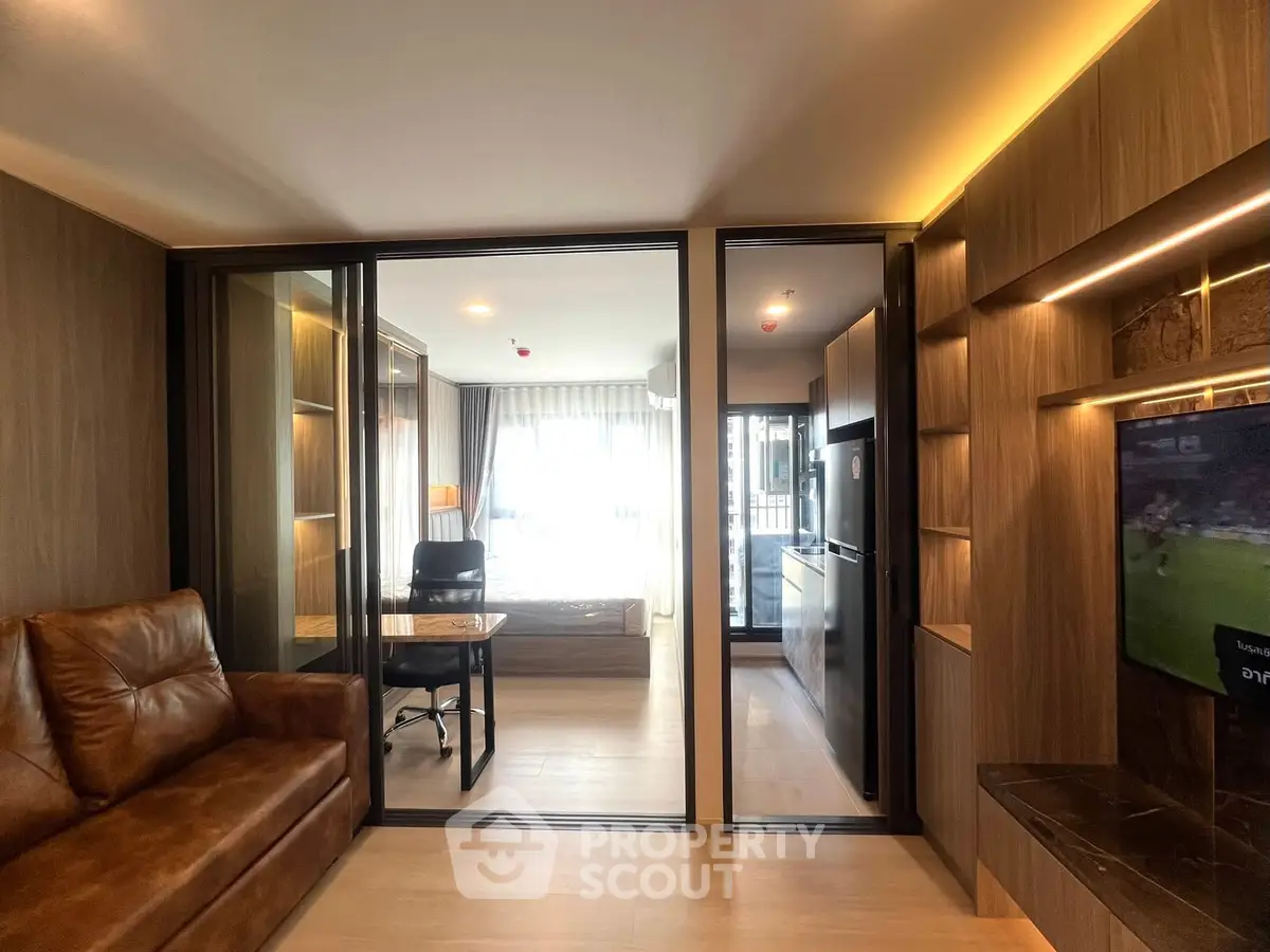Modern living room with glass partition and cozy leather sofa