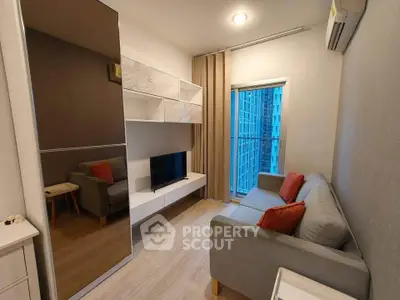 Modern living room with sleek design, featuring a cozy sofa, wall-mounted TV, and large window with city view.