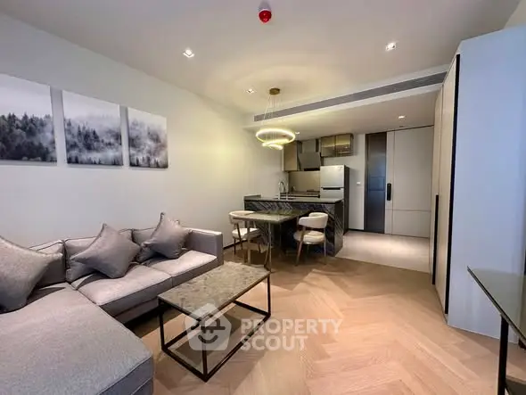 Modern open-plan living room and kitchen with stylish decor and lighting