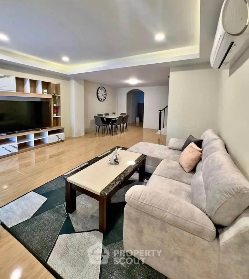 Spacious living room with modern decor and cozy seating area