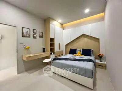 Modern bedroom with stylish decor and built-in storage solutions